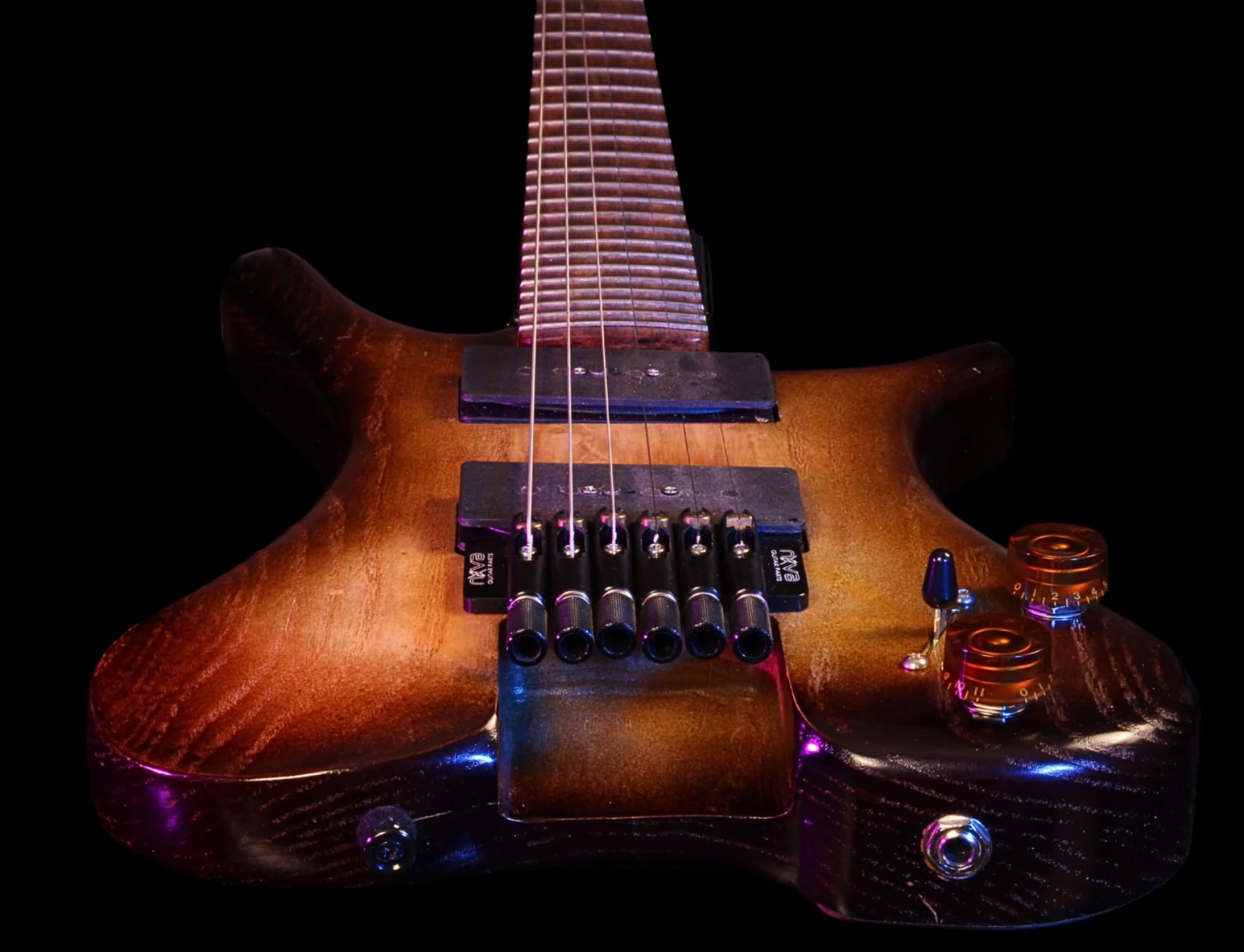 Physical Anesidora guitar body from an earlier design before flush-mounted string hardware