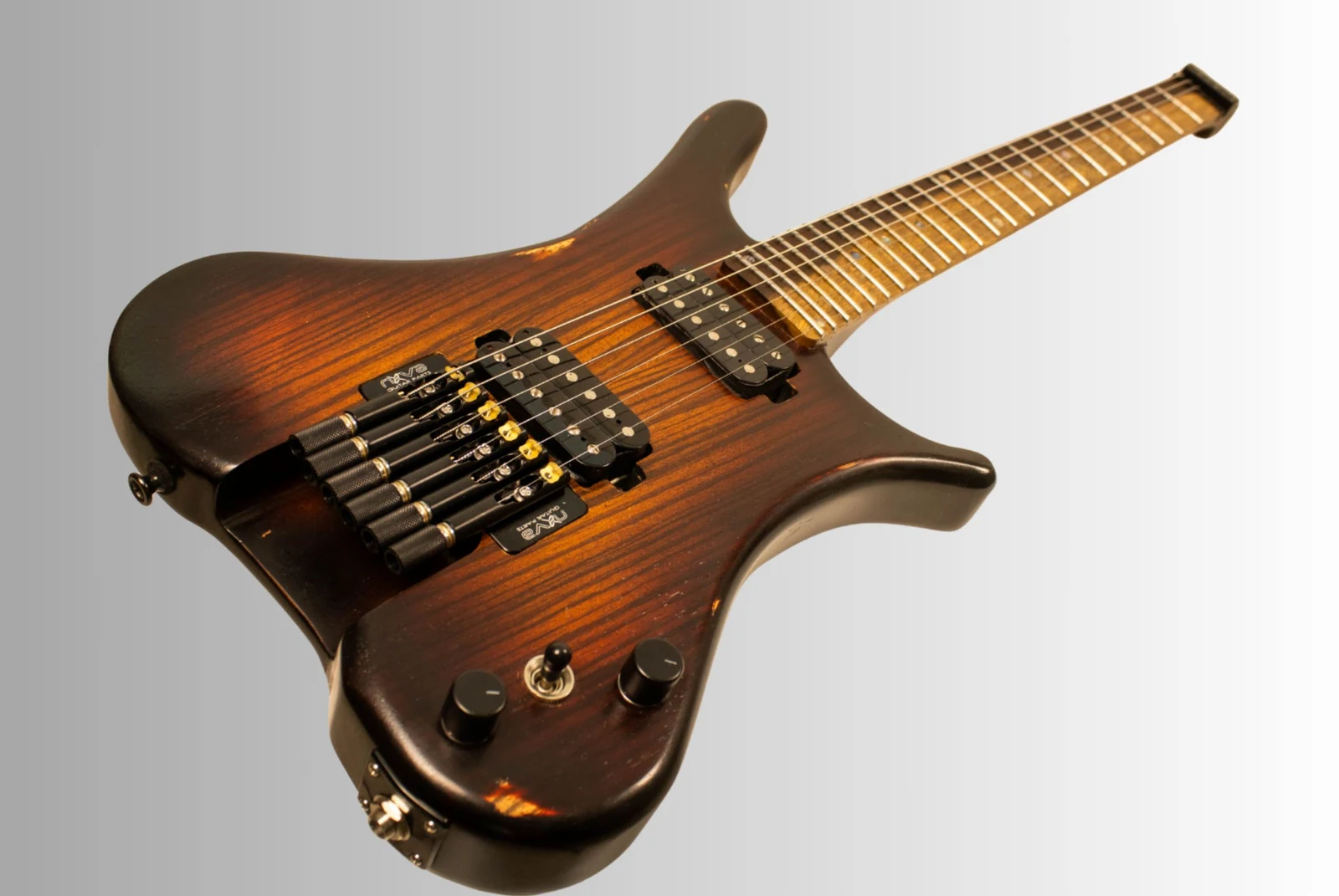 Finished Anesidora J804 headless guitar with a figured maple neck