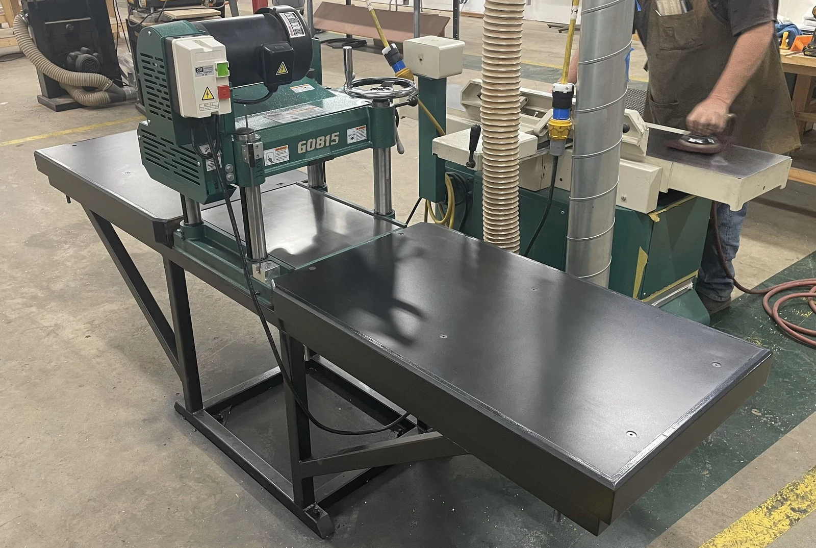 Completed planer installation with fabricated infeed and outfeed tables